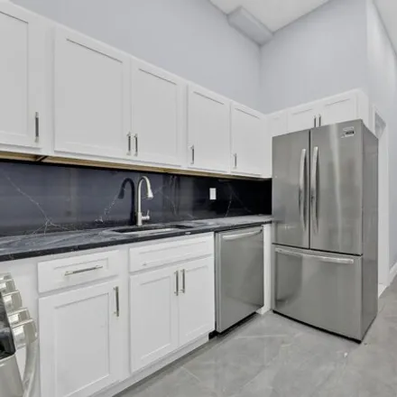 Buy this 6 bed townhouse on 60-31 54th Street in New York, NY 11378