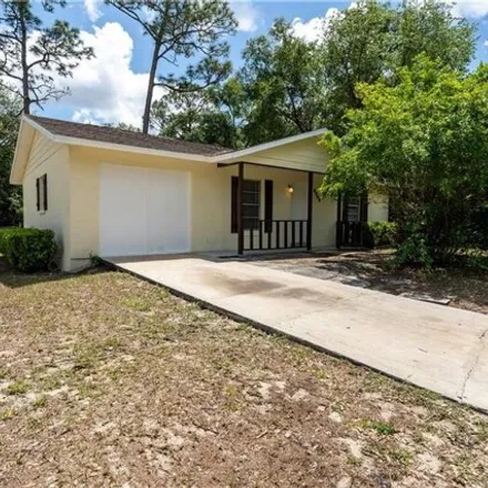 Buy this 4 bed house on 3709 Northeast 24th Court in Marion County, FL 34479