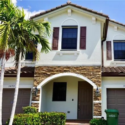 Rent this 3 bed townhouse on 5477 Nw 27th Ct in Margate, Florida