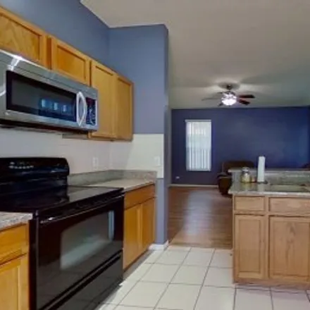 Rent this 4 bed apartment on 12309 Holly Jane Court in Southchase Village, Orlando