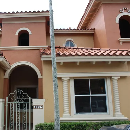 Rent this 3 bed townhouse on 4967 Tradewinds Terrace in Avon Park, Dania Beach