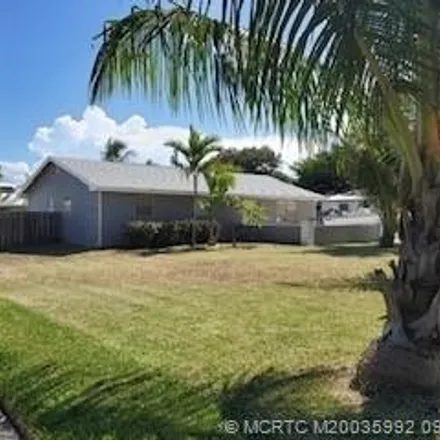 Rent this 3 bed house on 8020 Southeast Coconut Street in Martin County, FL 33455