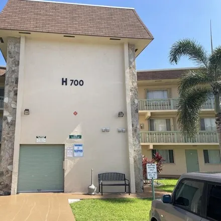 Rent this 1 bed condo on 700 Village Green Court in Palm Springs, FL 33461