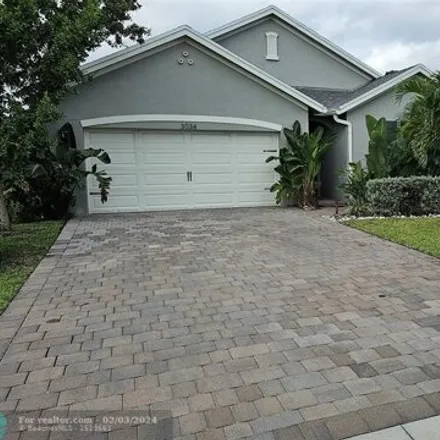 Rent this 4 bed house on Northeast Skyview Lane in Ocean Breeze, Martin County