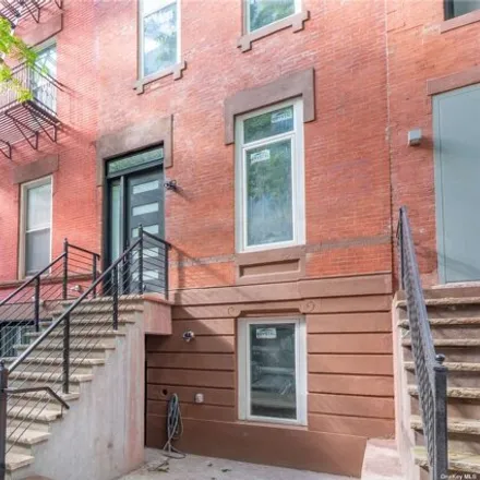 Buy this 8 bed house on 515 1/2 E 118th St in New York, 10035