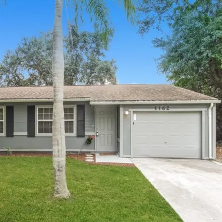 Rent this 3 bed house on 1162 Serenade St NW in Palm Bay, Florida