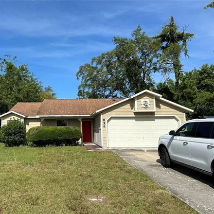Rent this 3 bed house on 896 Mentmore Circle in Deltona, FL 32738