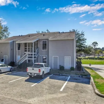 Rent this 2 bed condo on 16 April Point Drive South in Conroe, TX 77356