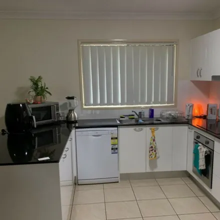 Rent this 4 bed apartment on 39 Highbridge Circuit in Carseldine QLD 4034, Australia