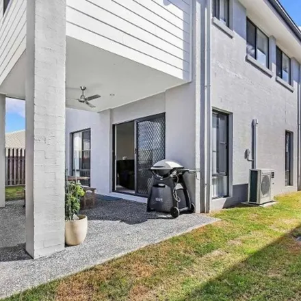 Rent this 4 bed apartment on Lahey Cove in Coomera QLD, Australia