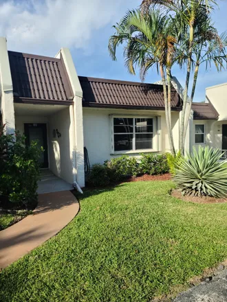 Buy this 2 bed townhouse on 103 Lake Susan Drive in Golden Lakes, Palm Beach County