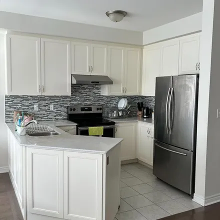 Rent this 3 bed townhouse on Merrybrook Trail in Brampton, ON L7A 4W3