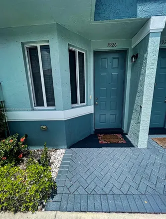 Rent this 2 bed townhouse on 1926 Hibiscus Lane in Riviera Beach, FL 33404