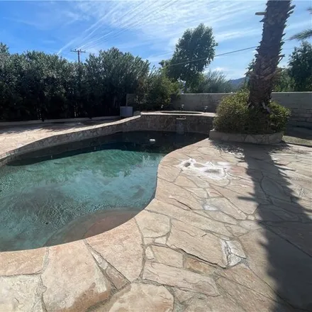 Rent this 4 bed house on Magnesia Falls Drive in Palm Desert, CA 92210