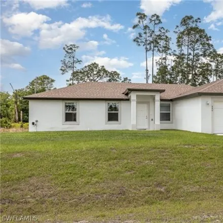 Buy this 4 bed house on 840 Puccini Ave S in Lehigh Acres, Florida