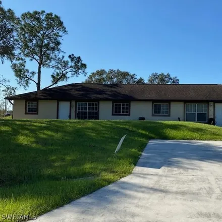 Rent this 3 bed duplex on 1564 Gilbert Avenue South in Lehigh Acres, FL 33973