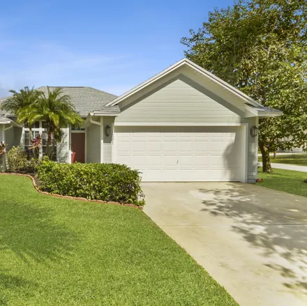 Buy this 3 bed house on 1301 Southwest Calmar Avenue in Port Saint Lucie, FL 34953