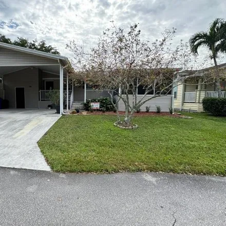 Buy this studio apartment on 6601 Colonial Drive in Margate, FL 33063