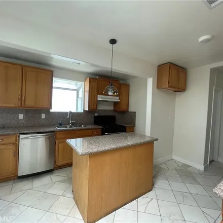 Rent this 3 bed apartment on 6438 Perry Road in Bell Gardens, CA 90201