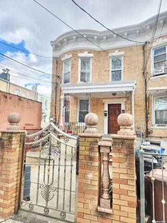 Buy this 7 bed house on 91-11 87th Street in New York, NY 11421