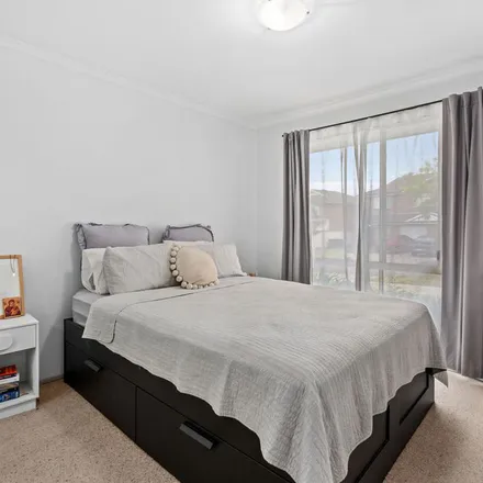 Rent this 3 bed apartment on Woolgoolga Avenue in Hoxton Park NSW 2171, Australia