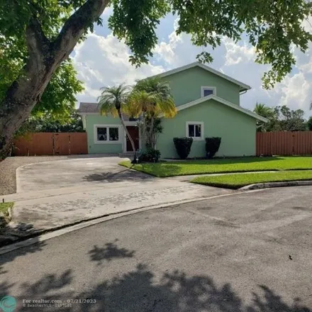 Rent this 4 bed house on 4972 Northwest 8th Street in Lakewood East, Coconut Creek