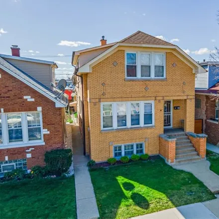 Buy this 4 bed house on 3138 North Luna Avenue in Chicago, IL 60641