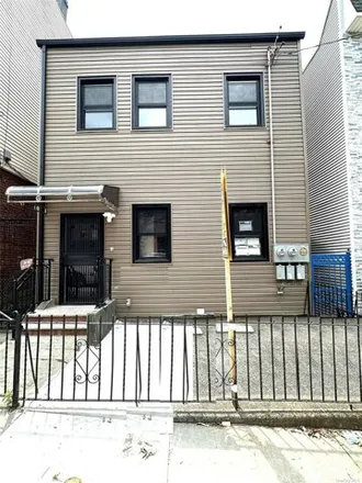 Buy this 5 bed house on 52-16 83rd Street in New York, NY 11373