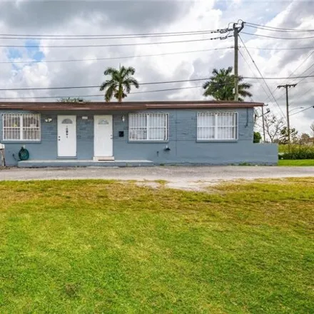 Buy this 4 bed house on 109 Northeast 1st Street in Belle Glade, FL 33430