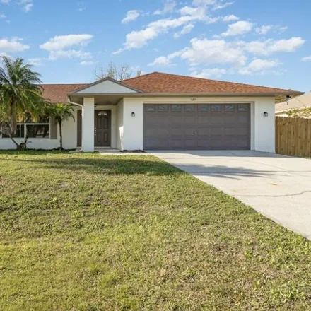 Buy this 4 bed house on 1677 Ashboro Circle Southeast in Palm Bay, FL 32909