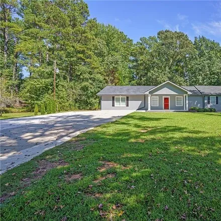 Buy this 4 bed house on 3285 Stonewall Tell Road in Atlanta, GA 30349
