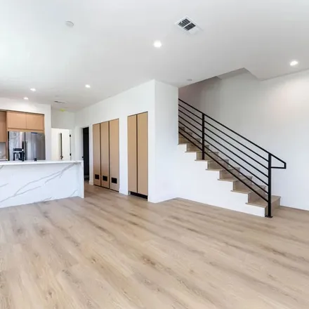 Rent this 4 bed townhouse on 4637 Saint Charles Place in Los Angeles, CA 90019