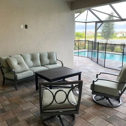 Rent this 4 bed apartment on Rapallo Street in Esplanade Golf & Country Club, Collier County