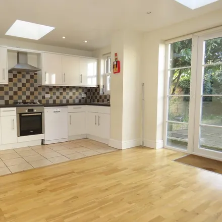 Rent this 4 bed townhouse on 1A Goodenough Road in London, SW19 3QW
