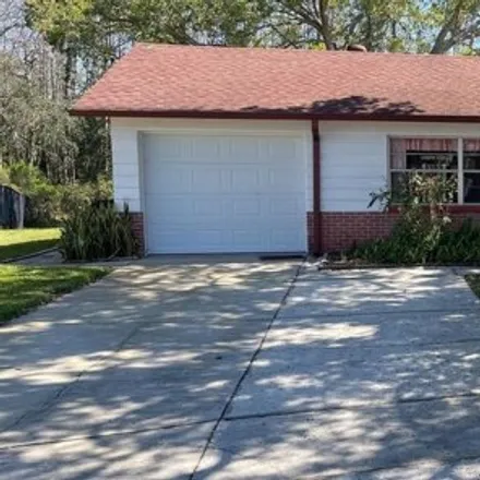 Rent this 3 bed house on 4246 Raccoon Loop in Seven Springs, Pasco County