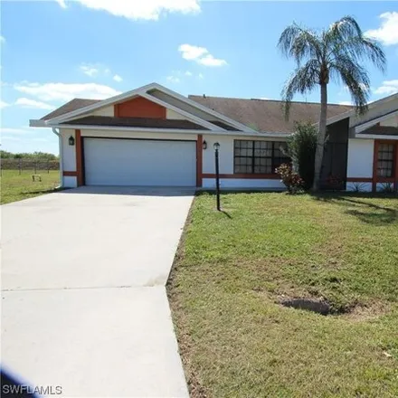 Rent this 3 bed house on 604 Weston Road in Lehigh Acres, FL 33936