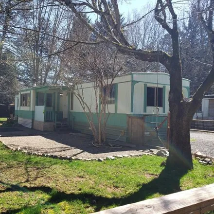 Buy this studio apartment on 169 South Sawyer Avenue in Cave Junction, Josephine County