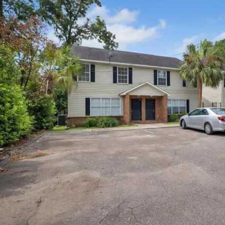 Rent this 4 bed townhouse on 859 W Brevard St Apt 1 in Tallahassee, Florida