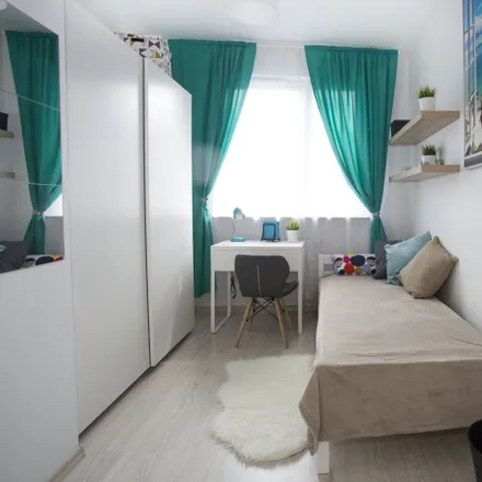 Rent this 4 bed room on Cybernetyki 2F in 02-677 Warsaw, Poland