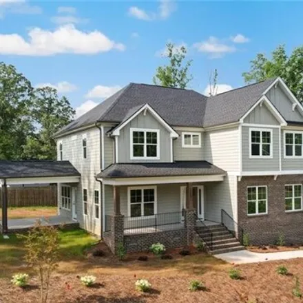 Buy this 4 bed house on 3701 Still Poplar Ct in Summerfield, North Carolina