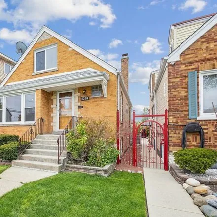 Buy this 3 bed house on 5228 South Lockwood Avenue in Chicago, IL 60638