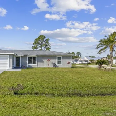 Buy this 3 bed house on 1892 Raintree Avenue in Palm Bay, FL 32909