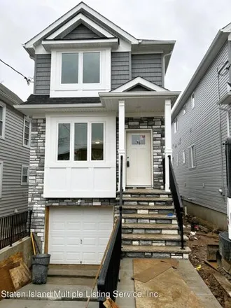 Buy this 3 bed house on 74 Hooker Place in New York, NY 10302