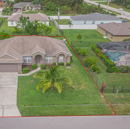 Buy this 3 bed house on 1215 Southwest Amboy Avenue in Port Saint Lucie, FL 34953