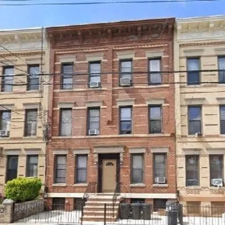 Buy this 12 bed townhouse on 64-41 Catalpa Avenue in New York, NY 11385