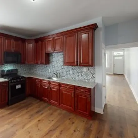 Rent this 4 bed apartment on 706 East 43rd Street in Wilson Park, Baltimore