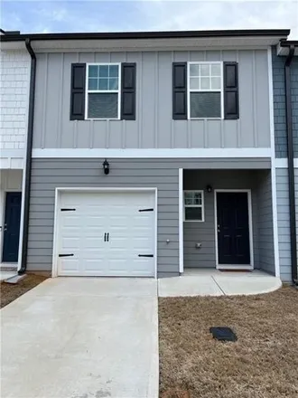 Rent this 3 bed townhouse on 5124 Lower Elm Street in Atlanta, GA 30349