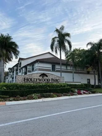 Rent this 2 bed condo on South Luna Court in Hollywood, FL 33021