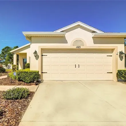 Buy this 2 bed house on 1167 Mystic Court in Spring Hill, FL 34609