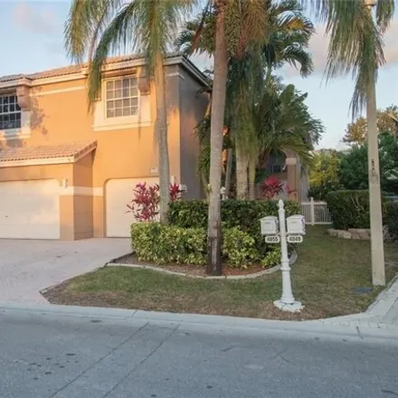 Buy this 4 bed house on 4825 Northwest 115th Avenue in Coral Springs, FL 33076